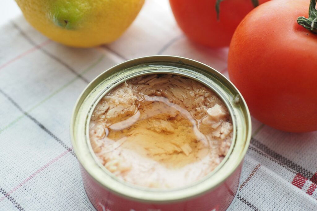 canned tuna on wooden table ,